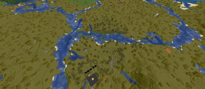 Spawn from above: a dark platform by the river, savanna and villages around it